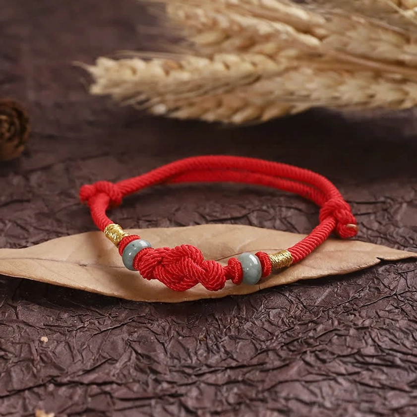 Red string couples matching bracelets showing dual set for relationship harmony and spiritual connection