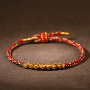 Red Buddhist Zodiac Natal Buddha Braided Rope Bracelet with Golden Twisted Weave and Adjustable Knot Closure
