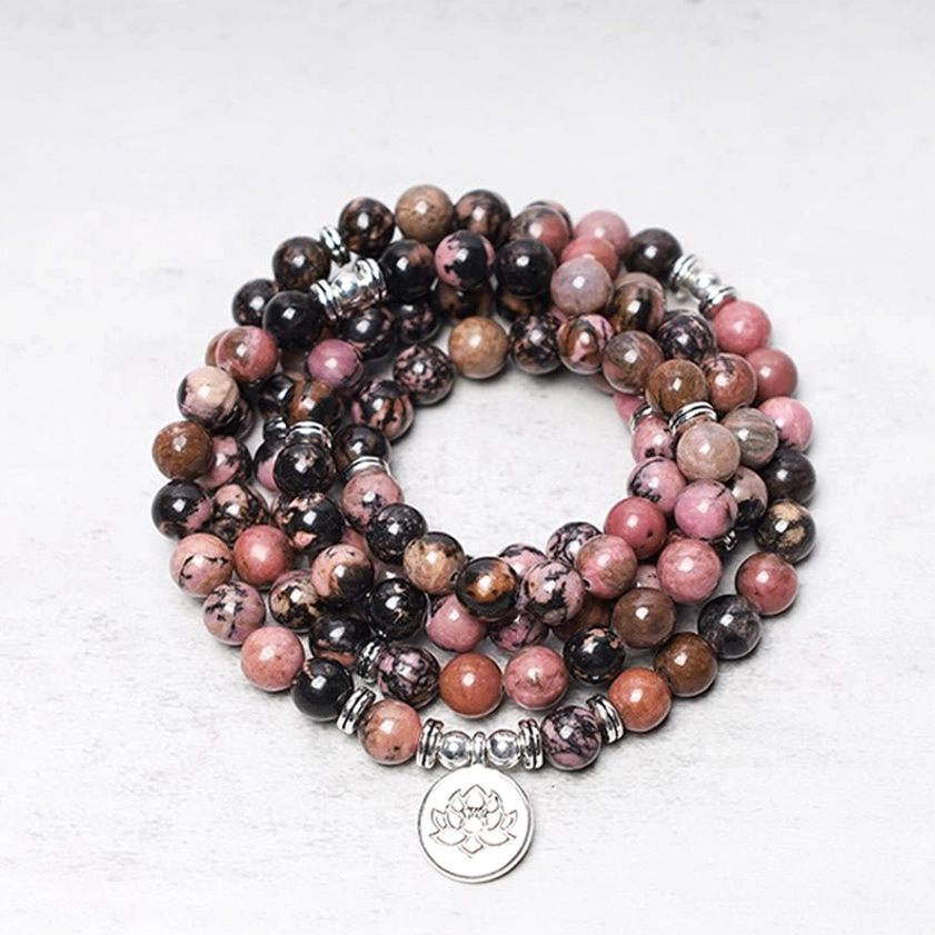 108 Rhodonite Mala Beads Bracelet with Silver Lotus Charm - Top-Down Close-Up View