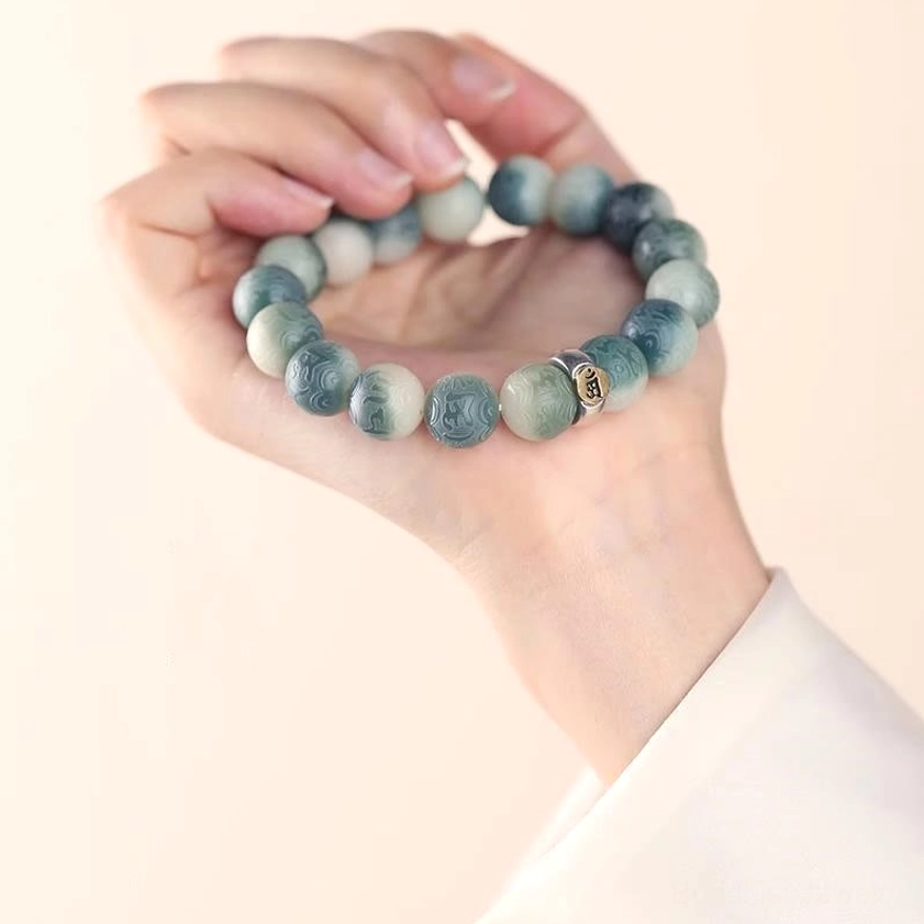 Rooster zodiac natal Buddha bracelet featuring Acalanatha Buddha protective charm