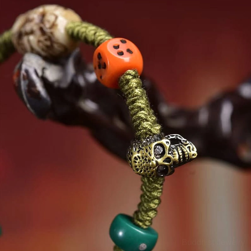 Extreme macro shot showing intricate braided rope texture and detailed metal skull bead component