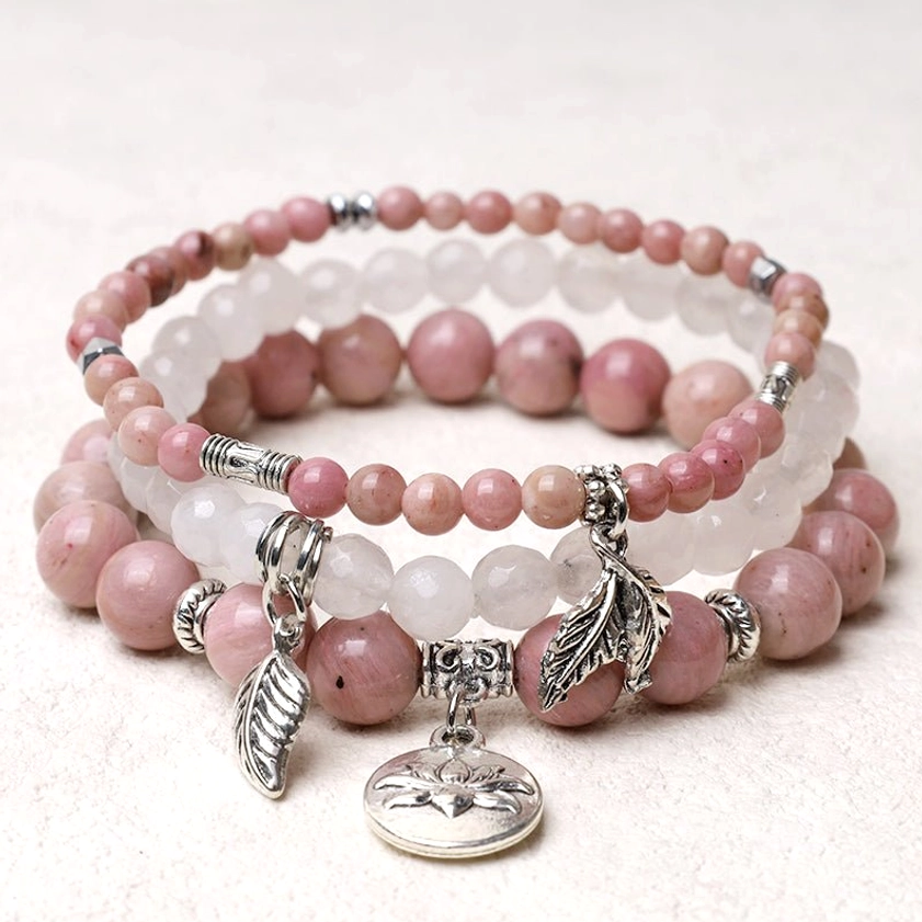 Rose quartz healing crystal bracelet with natural pink and white gemstone beads and silver charm pendant
