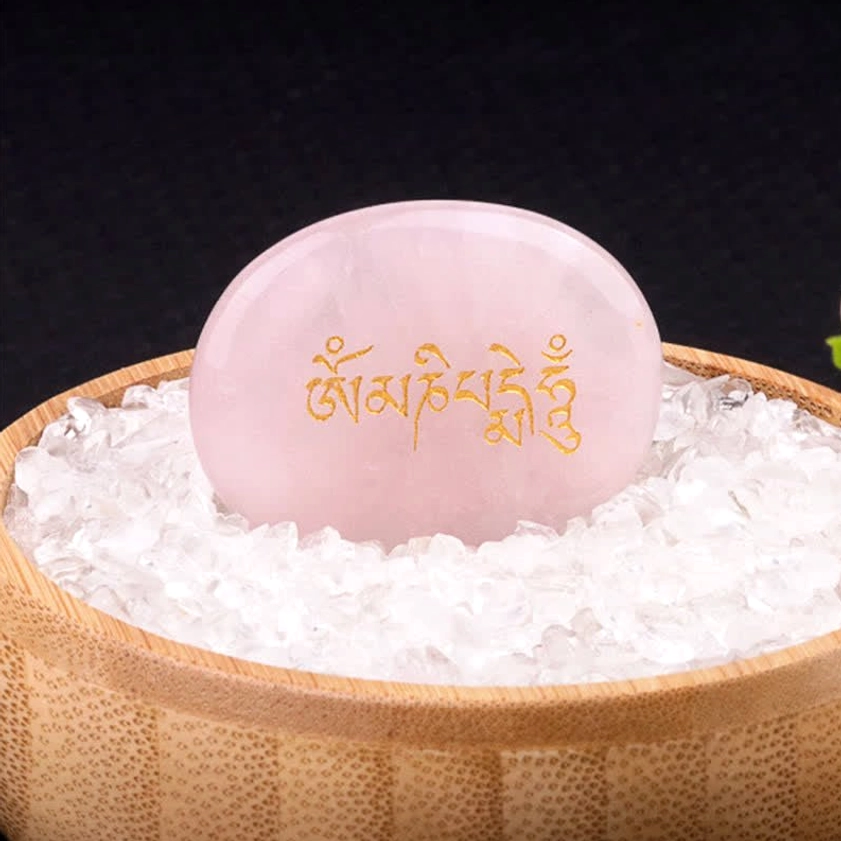 Om Mani Padme Hum rose quartz palm stone with golden Sanskrit carving