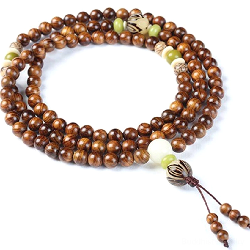 Full strand rosewood Buddhist prayer mala arranged in circle showing 108 beads, carved spacers, white accent bead and tassel