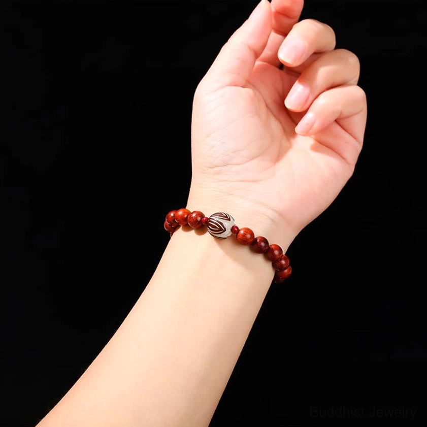 Buddhist bracelet worn on wrist showing natural fit for 14-16cm circumference, featuring rosewood warmth and jade calm energy