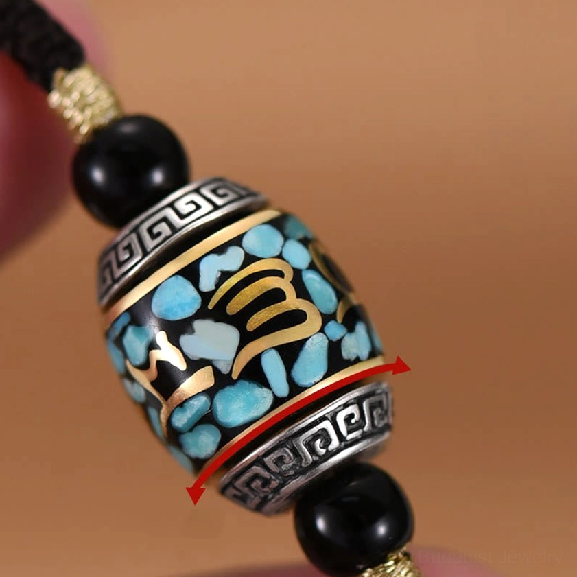 Rotatable Dzi Bead pendant close-up showing rotation mechanism and hand-crafted details