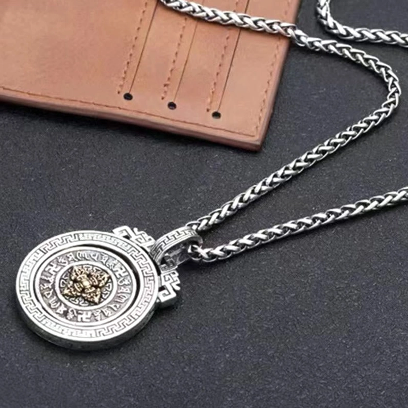Rotatable Buddhist necklace pendant with Om Mani Padme Hum mantra and rotating inner mechanism for meditation