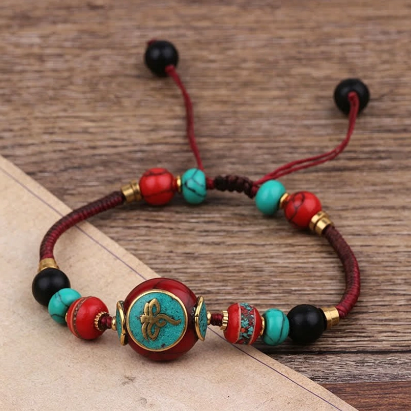 Round turquoise black white rope Buddhist bracelet detail shot, round bead adjustable meditation bracelet