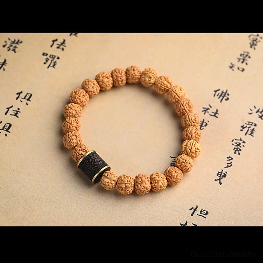 Rudraksha bodhi seed bracelet featuring green aventurine tortoise shell accent bead