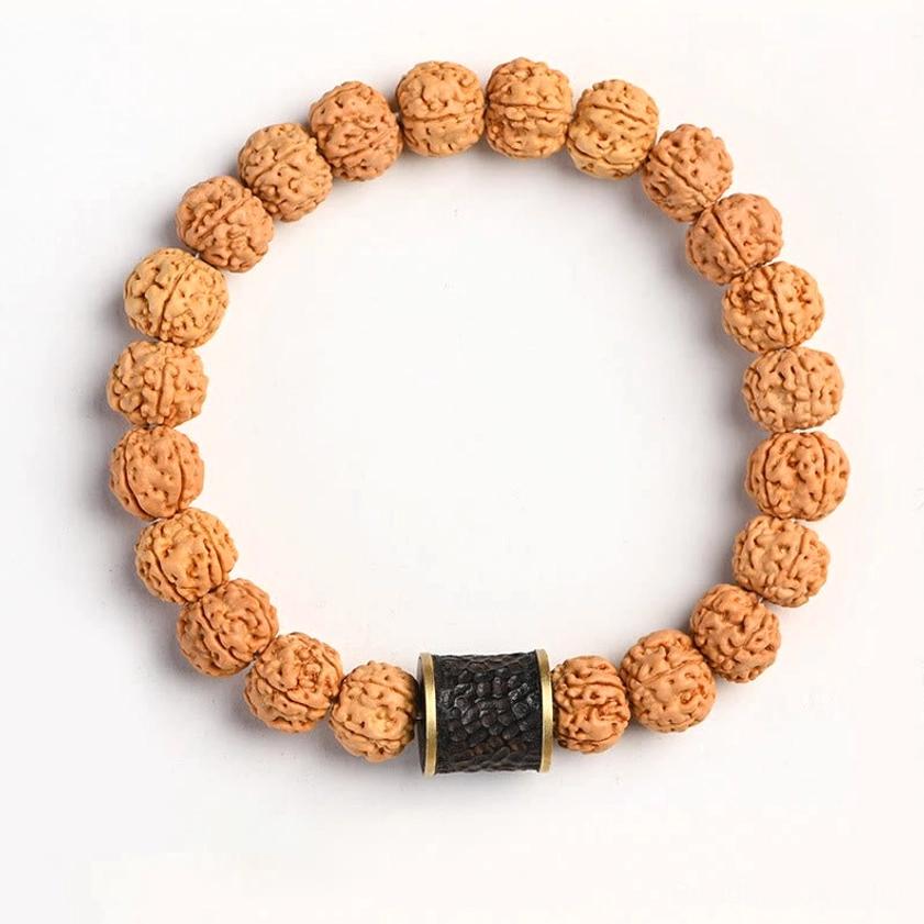 Rudraksha bodhi bracelet with ebony inlaid copper bead accent for unique aesthetic