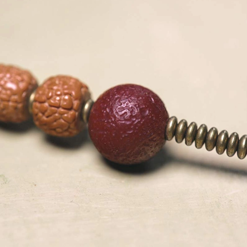 Rudraksha Bodhi Seed Mala Beads with Brass Coil Spacers - Sacred Seed Texture Detail