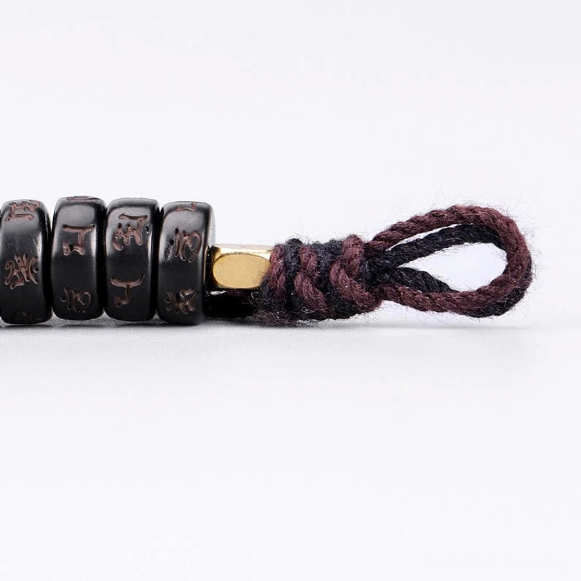 Buddhist bracelet fastener showing premium elastic string and braided cotton cord construction
