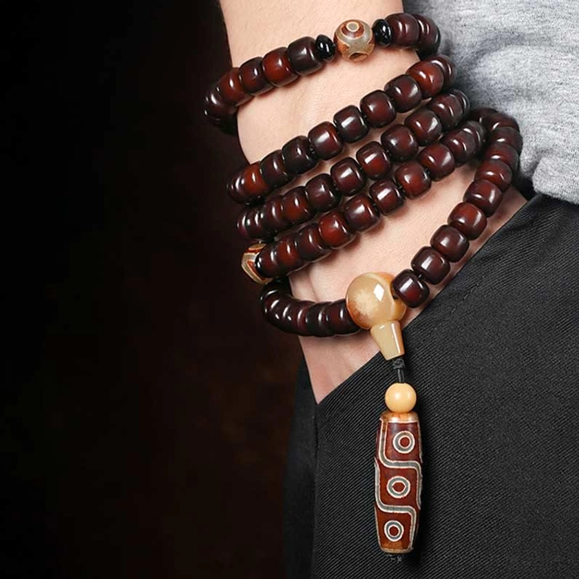 Sacred dzi bead mala bracelet featuring three-eye and nine-eye stones with prosperity jade for Buddhist meditation tool and spiritual companion