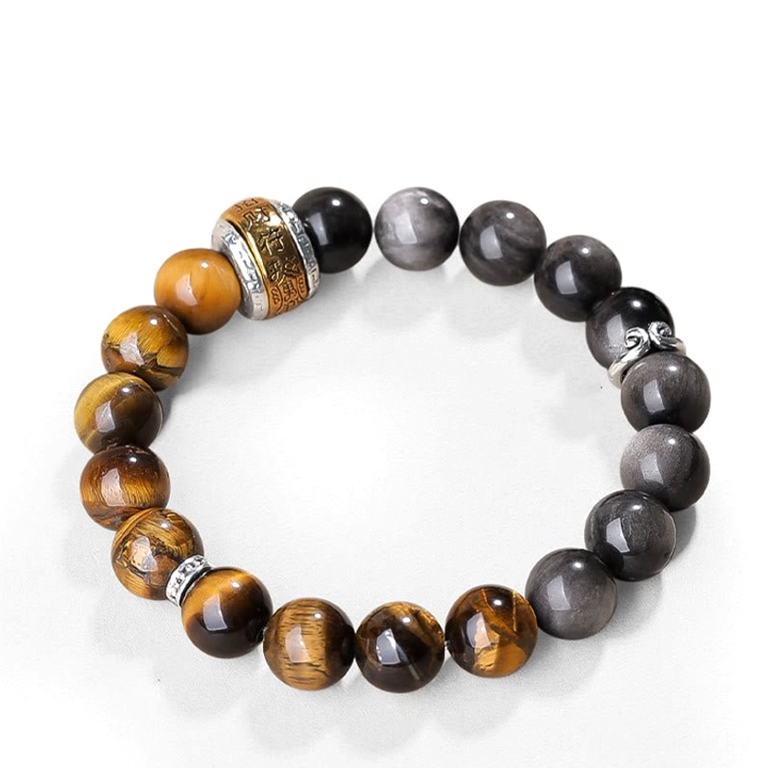 Silver Sheen Obsidian and Tiger's Eye Buddhist bracelet on white background with neatly arranged beads and engraved metal Om Mani Padme Hum charm