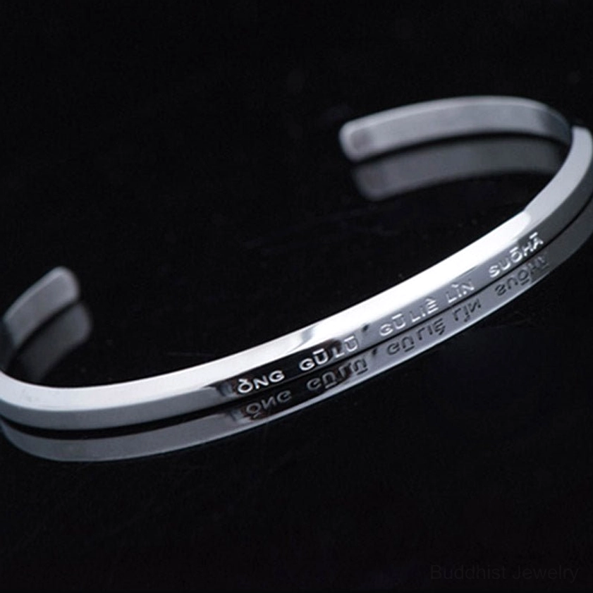 Single silver open cuff bracelet with om mani padme hum engraved text