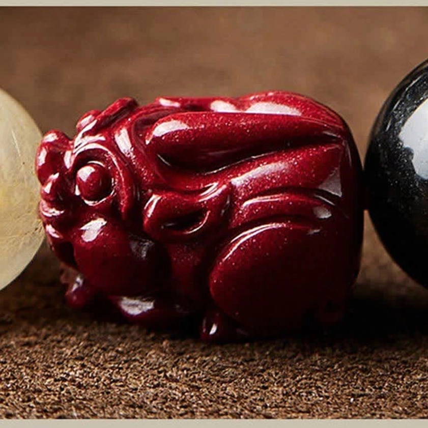 Sacred Buddhist prayer bracelet with om mani padme hum mantra and obsidian cinnabar stones