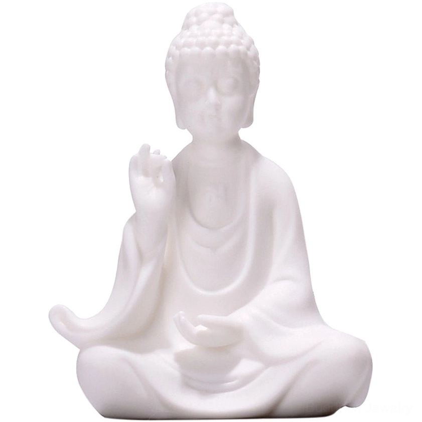 Sakyamuni Buddha ceramic statue with blessing hand mudra in full lotus pose, matte white ceramic on dark background
