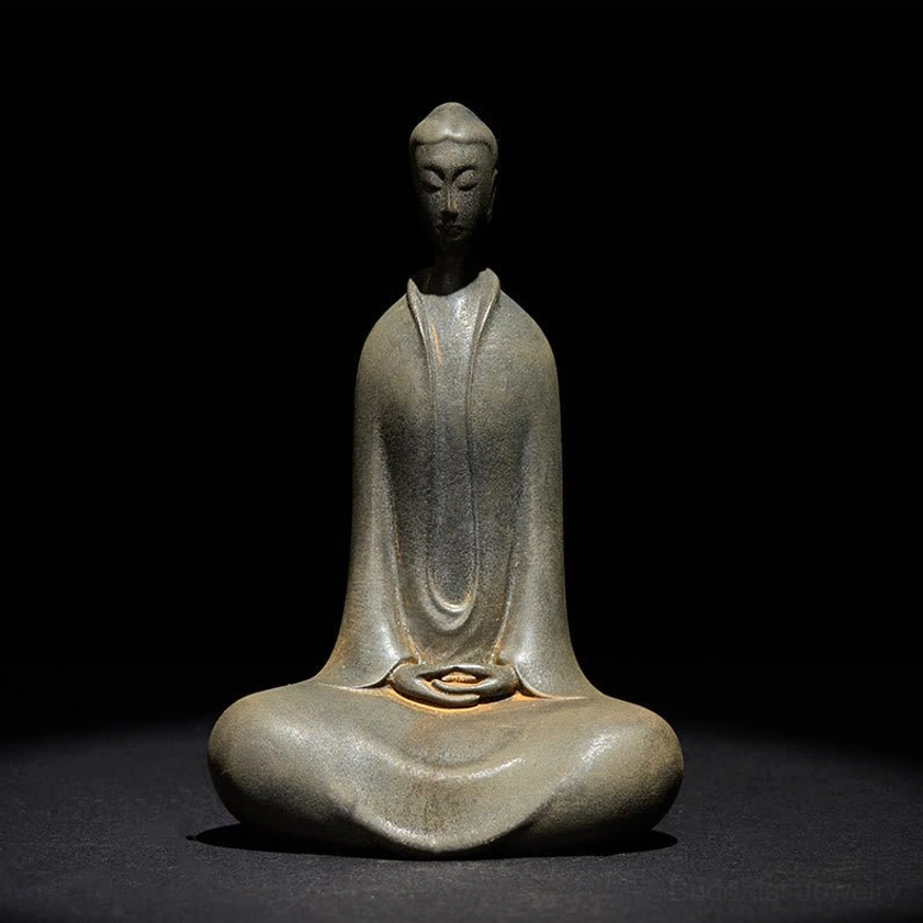 Full seated Sakyamuni Buddha statue in dhyana mudra from low angle view, grey-brown iron resin