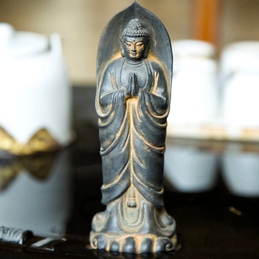 Iron powder resin Buddha Namaste statue close-up showing craftsmanship detail of robe carving and weathered finish