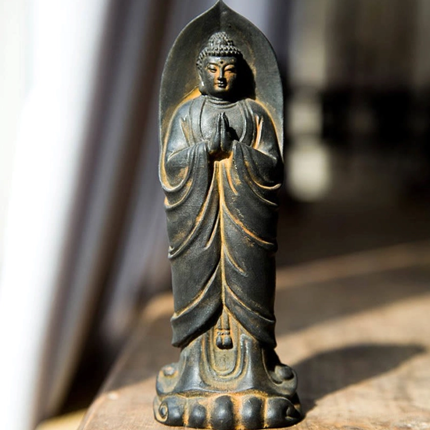 Sakyamuni Buddha Namaste meditation statue indoor desktop display with rustic bronze patina and intricate carved details