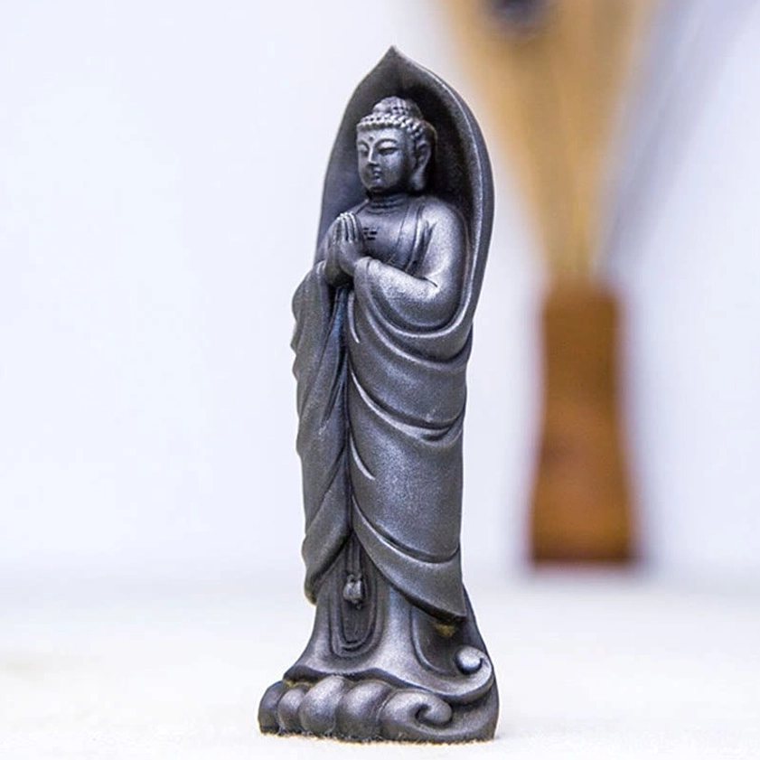 Iron powder resin Sakyamuni Buddha Namaste statue detail shot showing halo carving and prayer hands gesture