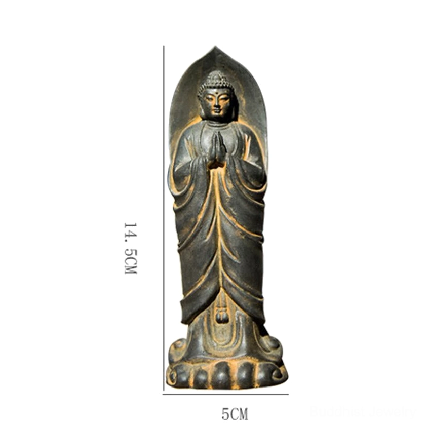 Sakyamuni Buddha Namaste statue front perspective view with book and wooden background, spiritual meditation decoration