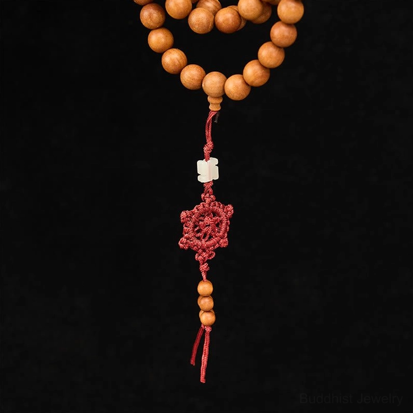 Red sandalwood mala beads texture close-up showing natural wood quality and finish