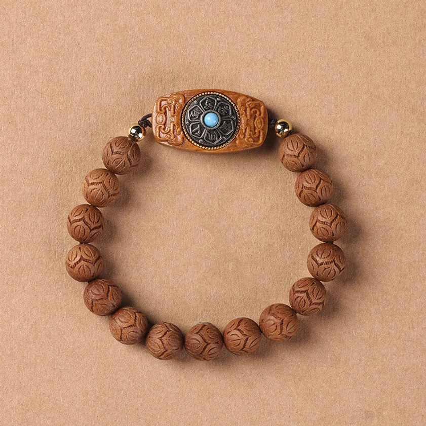 Sandalwood Buddhist bracelet with protection and calming properties, natural wood tone