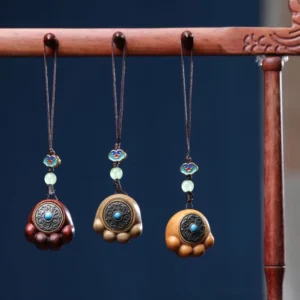 Three sandalwood cat paw phone charms displayed together showing red sandalwood, green sandalwood, and classic sandalwood variants with enamel cloud beads and jade spacers