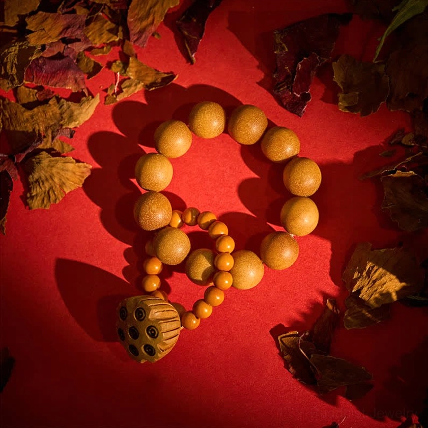 Sandalwood lotus meditation palm beads alternative view with hand positioning, showing tactile meditation technique and hand-polished bead texture