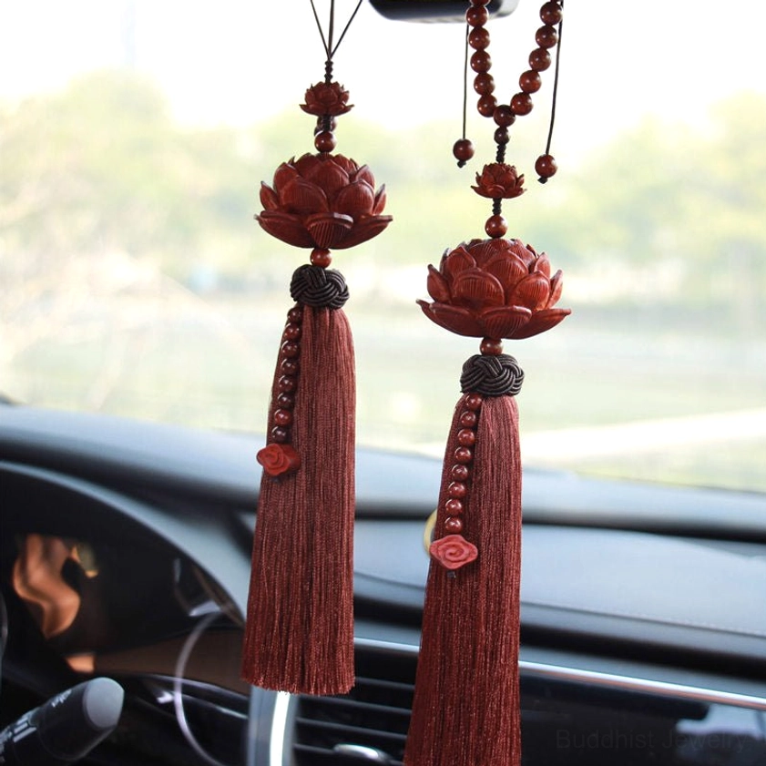 Red sandalwood lotus tassel car hanging decoration with beaded accents displayed on vehicle dashboard