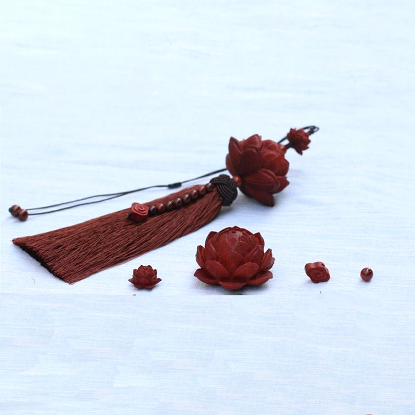 Handcrafted wooden lotus carvings and sandalwood beads showing semi-finished tassel decoration pieces