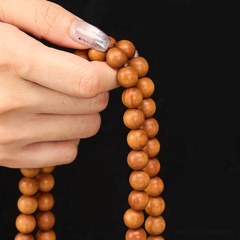 Handmade red sandalwood mala in gift presentation showing packaging and craftsmanship