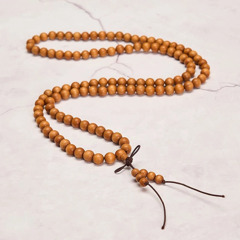 Multiple red sandalwood prayer mala sizes comparison for meditation practice