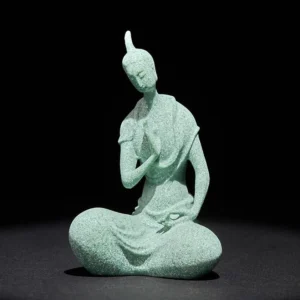 Handcrafted sandstone Buddha statue with serene expression, seated in meditation pose, light green matte finish, front full-body view
