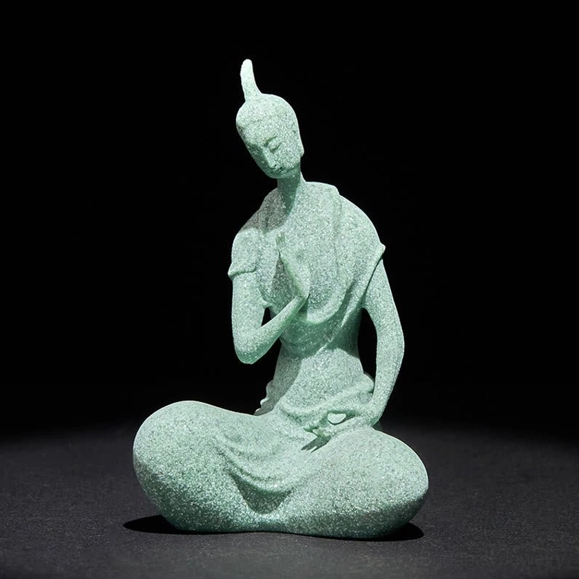 Handcrafted sandstone Buddha statue with serene expression, seated in meditation pose, light green matte finish, front full-body view