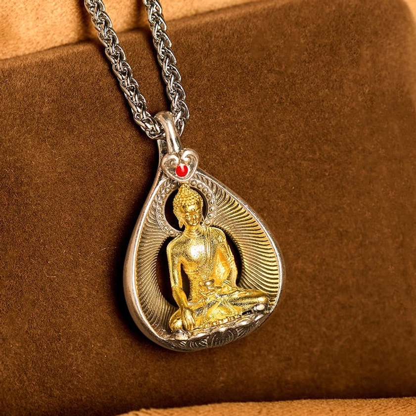 Shakyamuni Buddha Buddhist necklace pendant showing compassion and serenity symbolism of historical Buddha