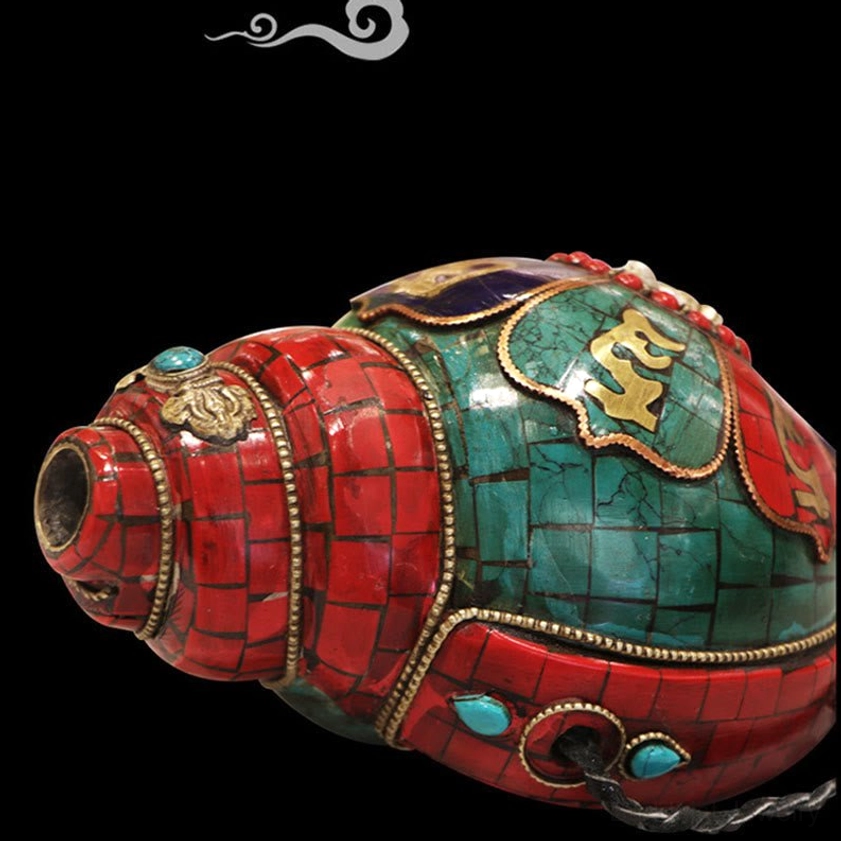 Mouth opening of sacred Shankha conch with red turquoise mosaic and inlaid gold Sanskrit mantras