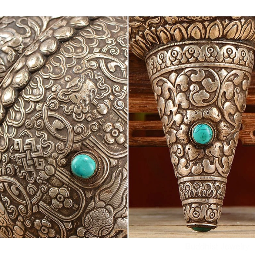 Detailed close-up of Eight Auspicious Symbols engraved on Shankha conch shell with turquoise stone inlays