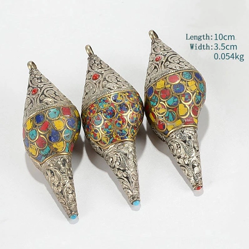 Set comparison of Buddhist shankha conch shell decorations in different sizes with carved silver metal and enamel inlay work