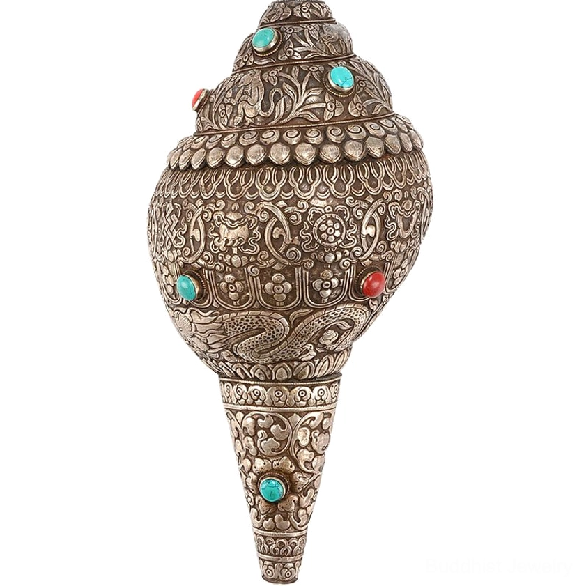 Top view of embossed Shankha conch shell showing intricate carved Buddhist motifs and turquoise gemstone detailing