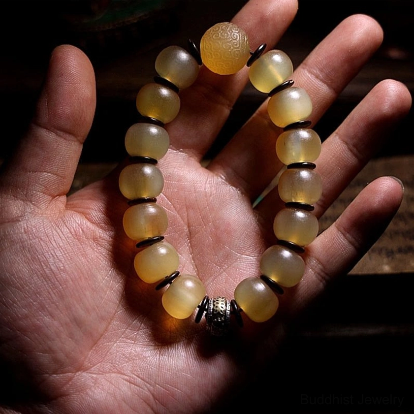 Natural sheep horn beads Om Mani Padme Hum bracelet showing authentic material quality and Tibetan silver metalwork
