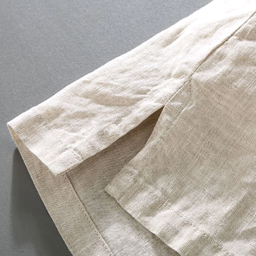 Short sleeve shirt cuff and hem details of linen Buddhist meditation set showing loose fit design