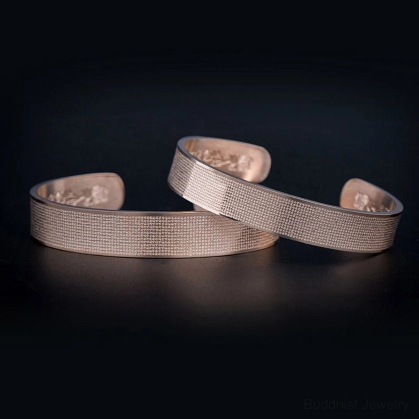 Shurangama Mantra titanium steel bracelet ends detail showing engraved Sanskrit characters and polished finish