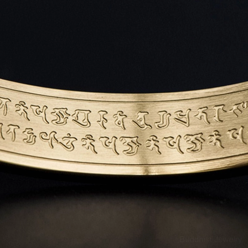 Gold Shurangama Mantra titanium steel Buddhist bracelet demonstrating adjustable open cuff design