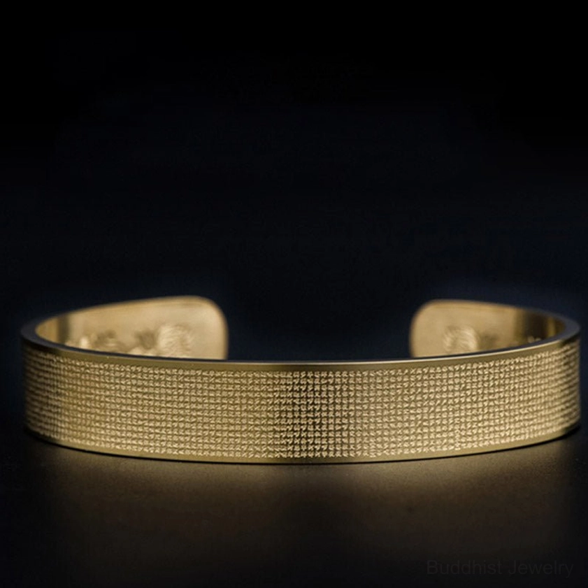 Gold Shurangama Mantra titanium steel bracelet close-up front view with full Sanskrit mantra engraving