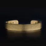 Gold Shurangama Mantra titanium steel open cuff bracelet front view with full engraved Sanskrit text