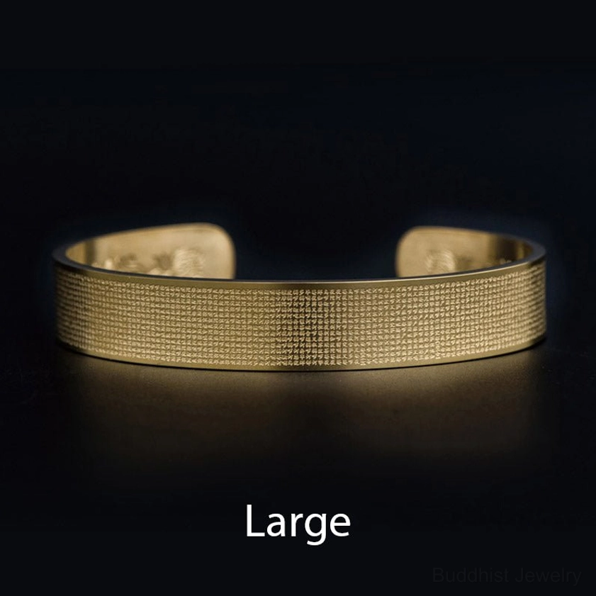 Large size gold Shurangama Mantra engraved titanium steel Buddhist protection bracelet flat lay