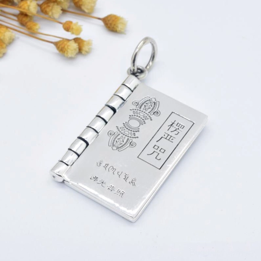 Silver Shurangama Mantra book pendant necklace with protective Buddhist scripture and hinged flip pages