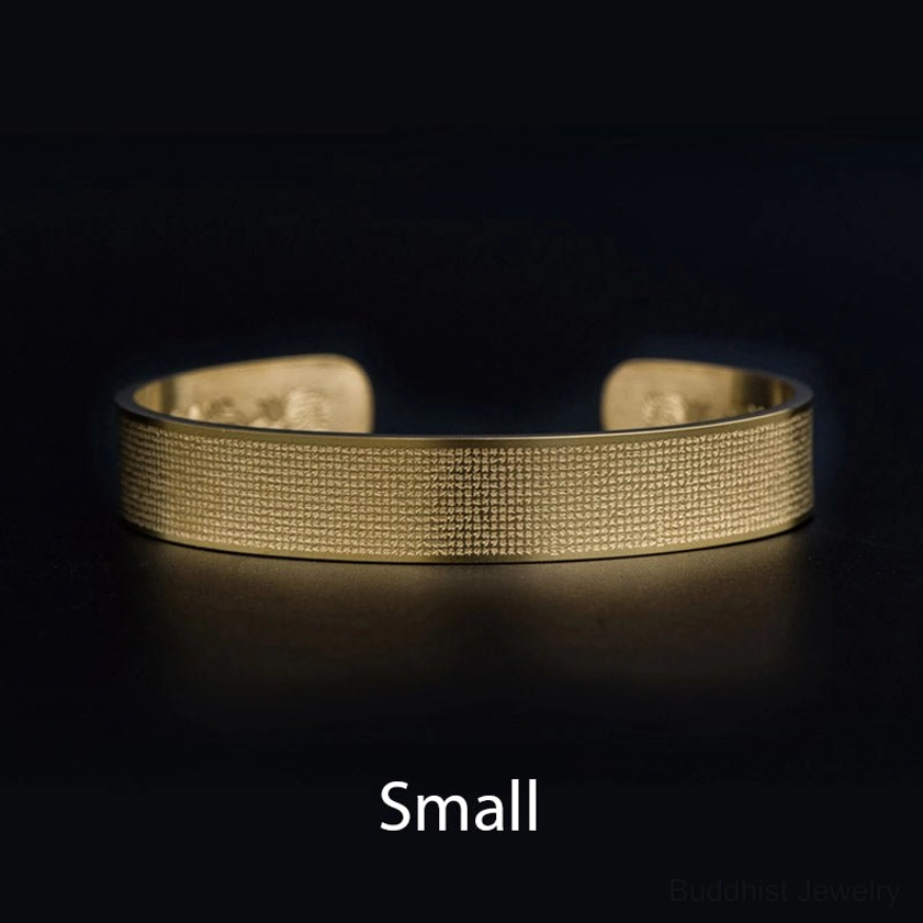Small size gold Shurangama Mantra engraved titanium steel Buddhist bracelet flat lay
